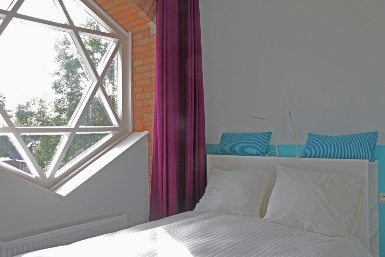 hotel dorpslogement pieterburen groningen bed with corridor